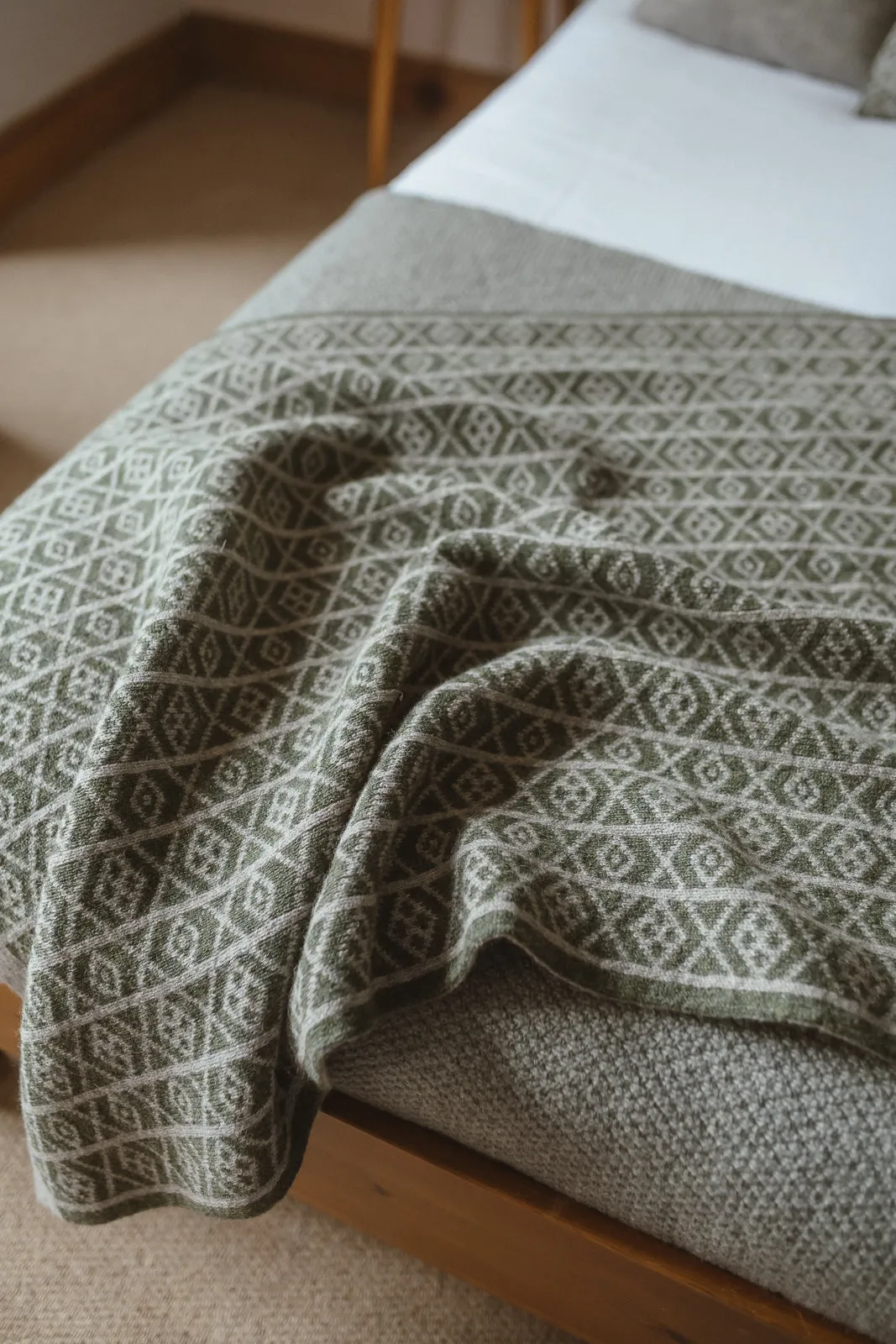 The Ruskin British Wool Jacquard Blanket in Ochre / Cream